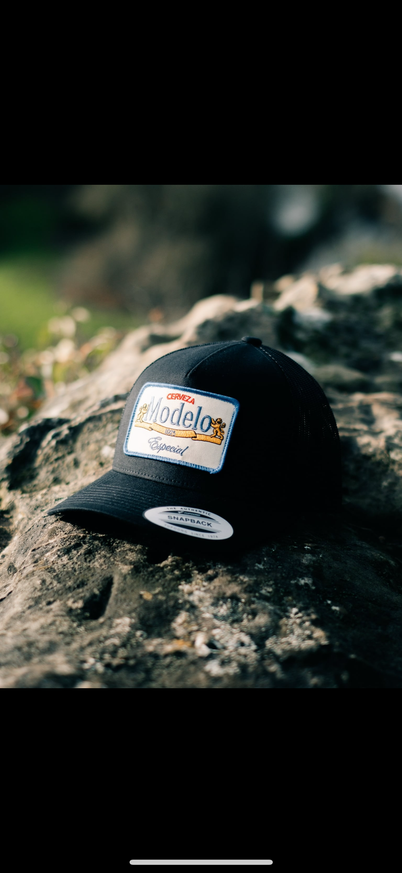 Modelo Patch on a Black 5 - Panel Trucker Hat